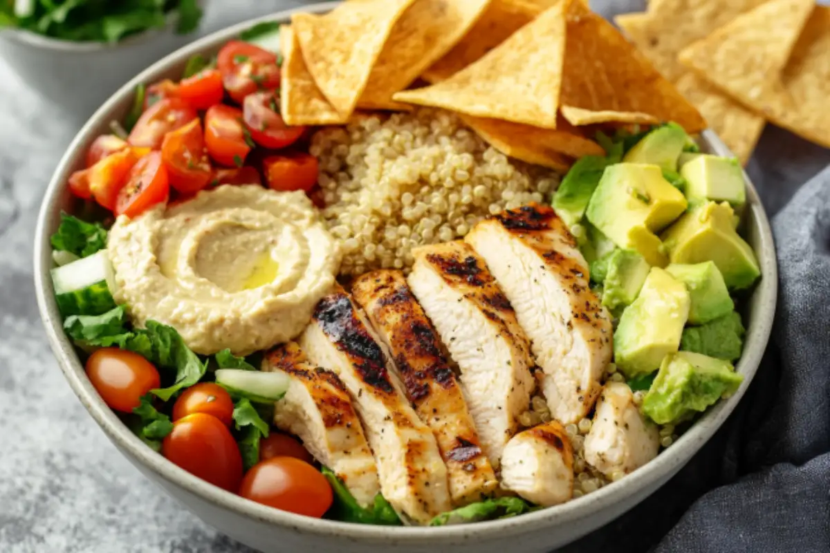  Customizable Greek chicken bowl with quinoa, hummus, and avocado