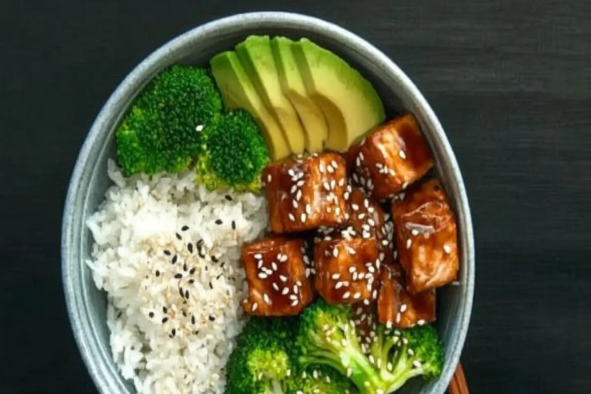 Teriyaki salmon bowl with rice, broccoli, and avocado