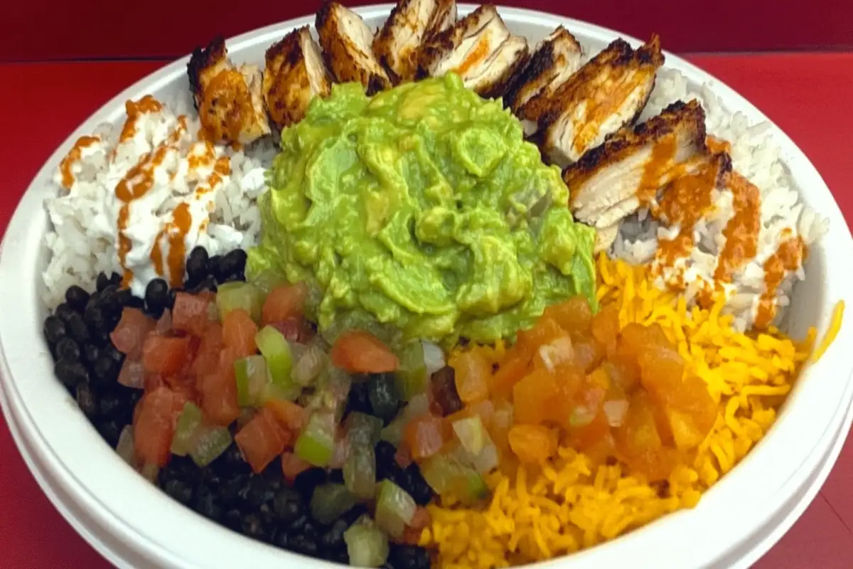 A vibrant taco bowl with layers of ingredients