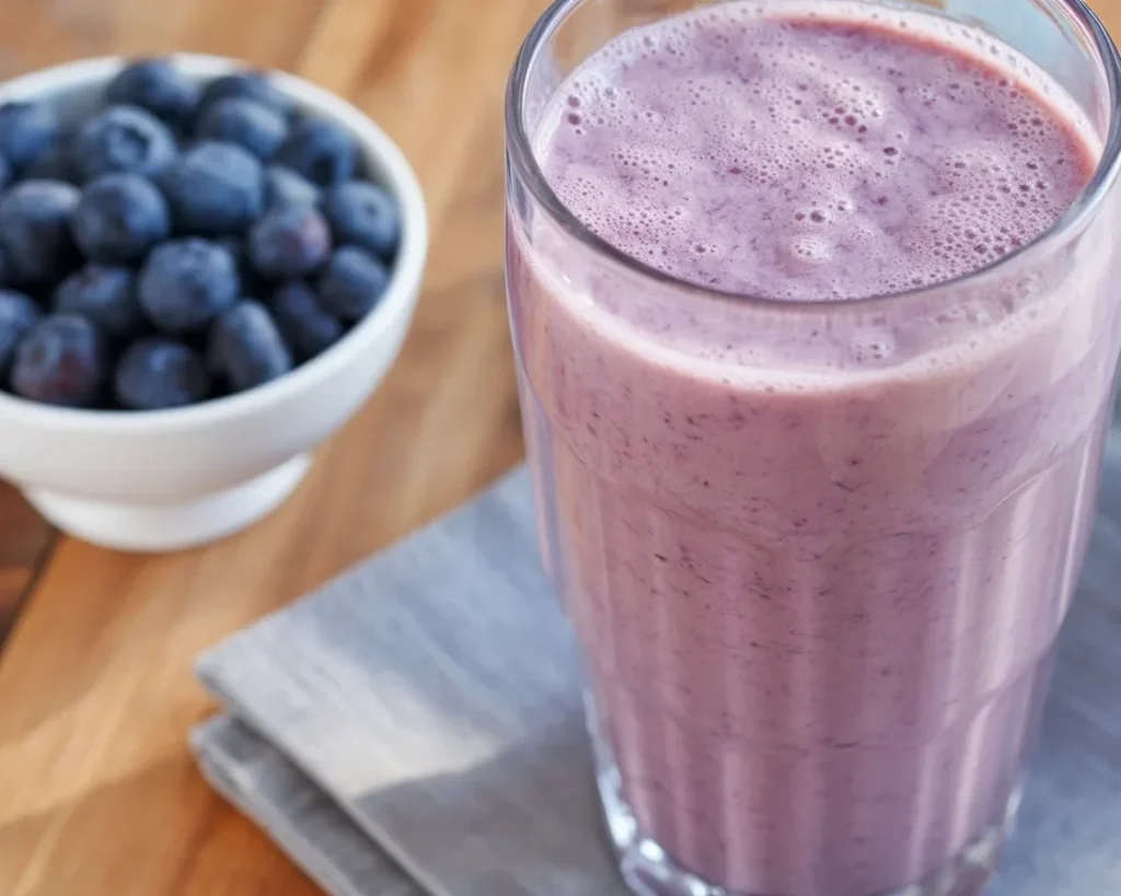 Blueberry-Banana Smoothie with fresh ingredients in a blender.