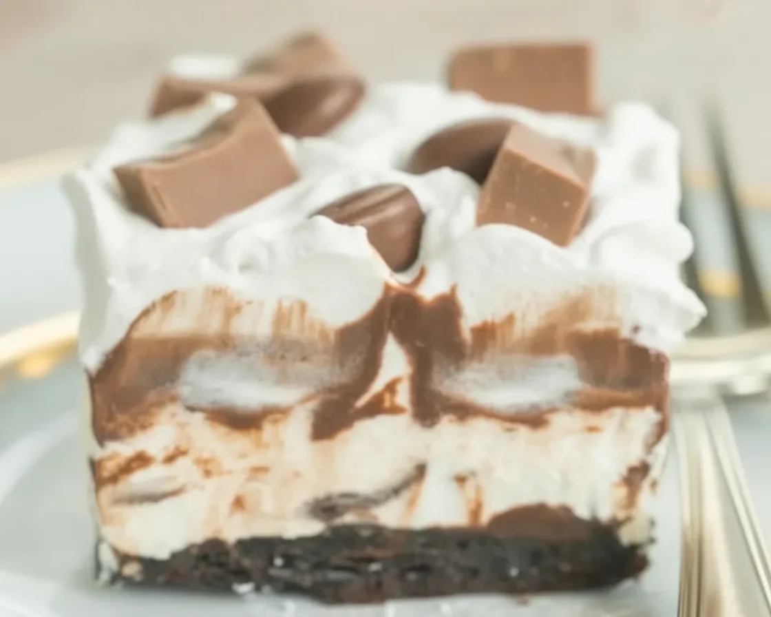 Delicious Peanut Butter Cup Icebox Cake with layers of chocolate and peanut butter mousse.