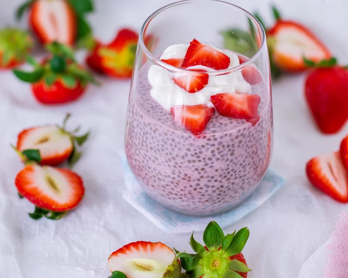 Delicious Strawberry Chia Pudding Breakfast served in a bowl with fresh strawberries
