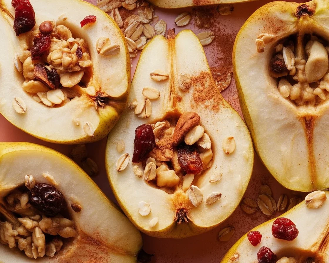 Delicious baked pears with cinnamon, maple syrup, and Greek yogurt topped with granola.