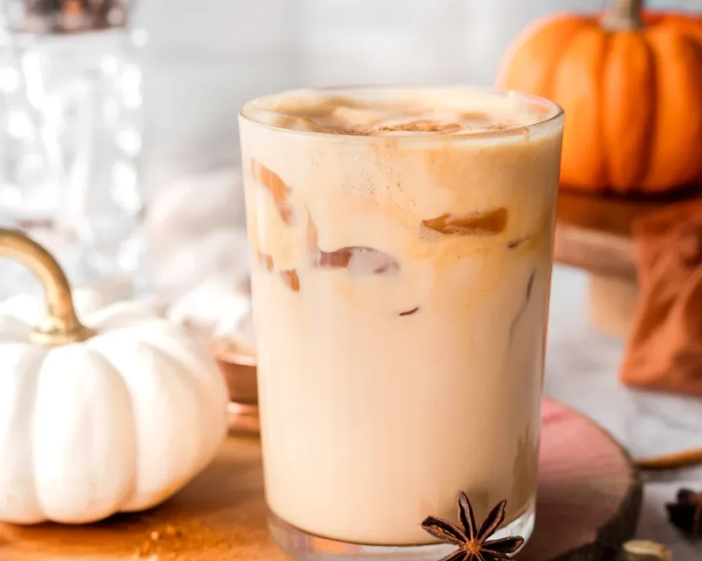 Iced Pumpkin Cream Chai Tea Latte with pumpkin foam and chai spices