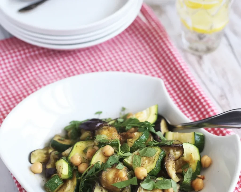 Grilled eggplant and zucchini with feta cheese, drizzled with olive oil and herbs.