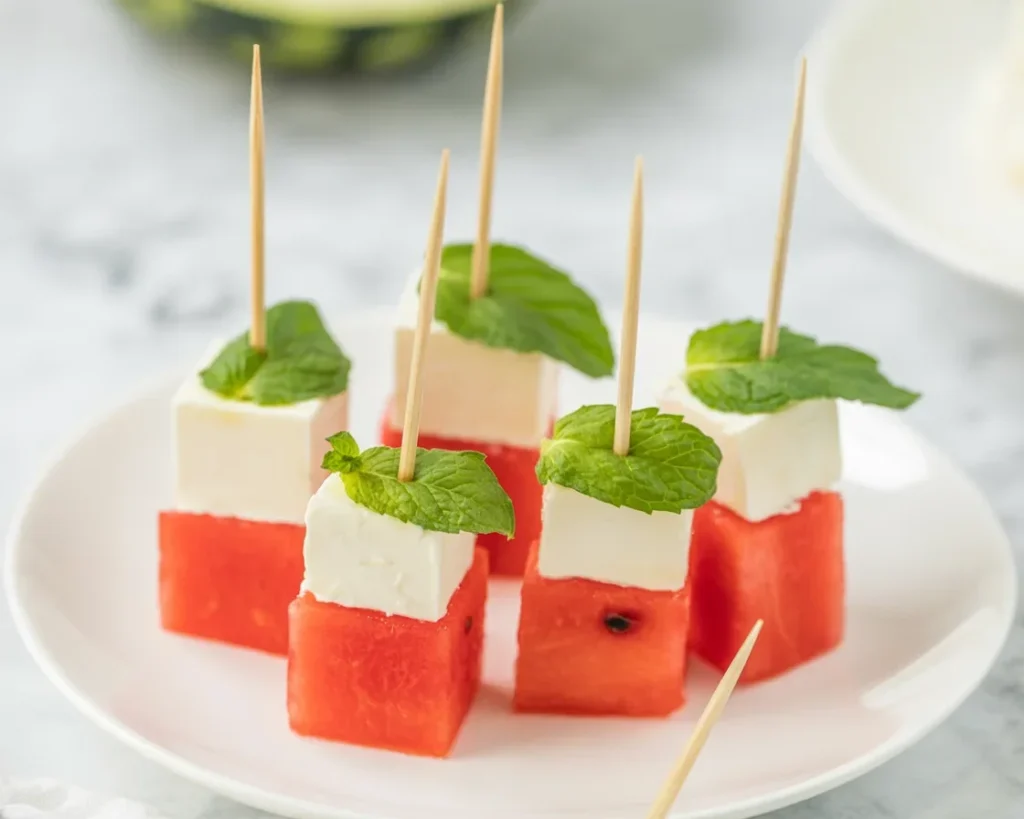 Refreshing Watermelon Feta Bites appetizer with basil and hot honey.