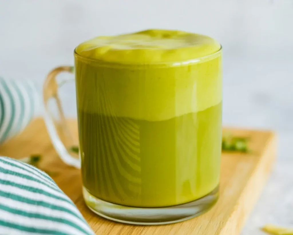 Lavender Pistachio Oat Latte topped with lavender oat milk foam