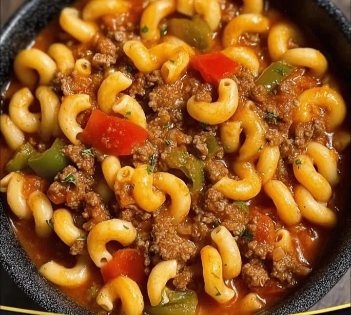 Bowls of old-fashioned goulash with spices and herbs
