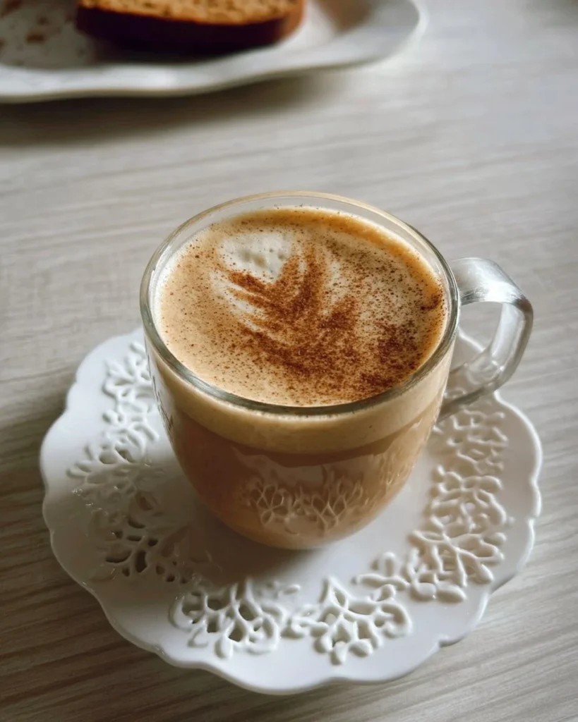 Delicious Banana Bread Latte topped with whipped cream and a sprinkle of cinnamon