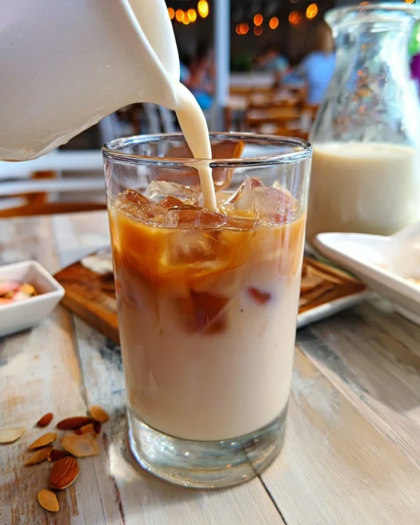 Delicious dirty horchata drink served in a glass with cinnamon and coffee