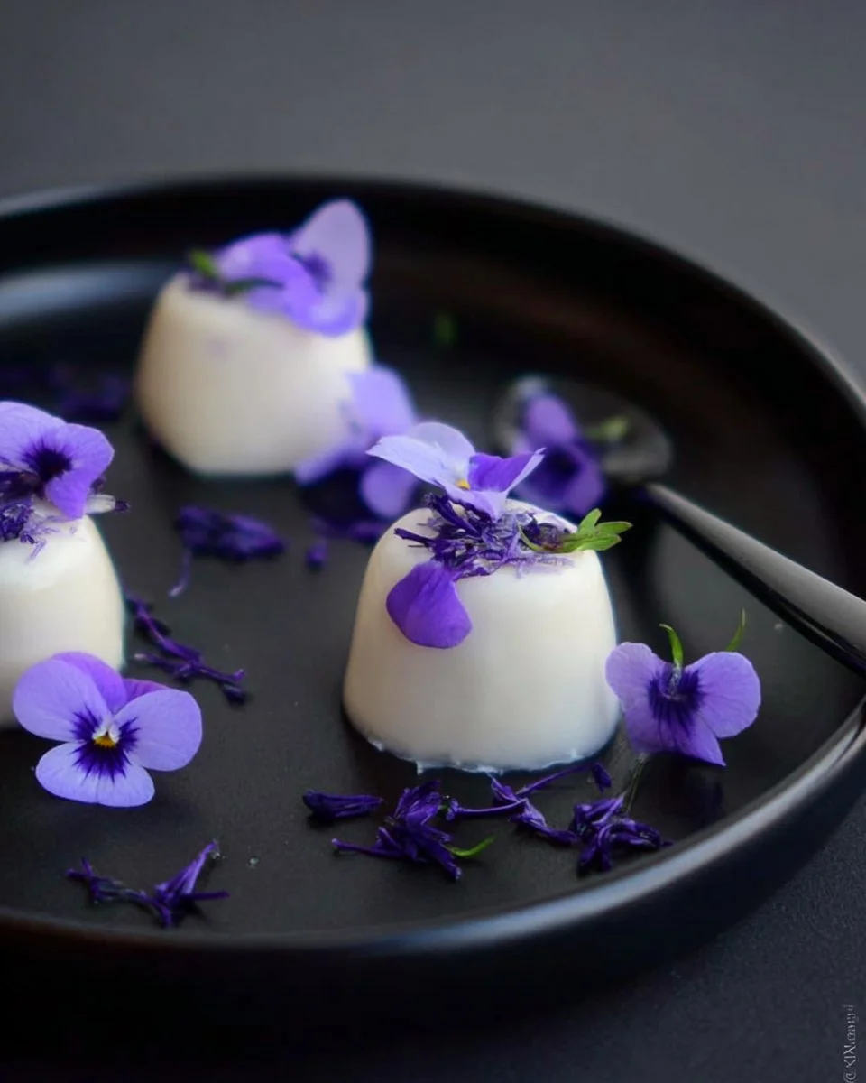 Delicious Violet Panna Cotta garnished with edible flowers