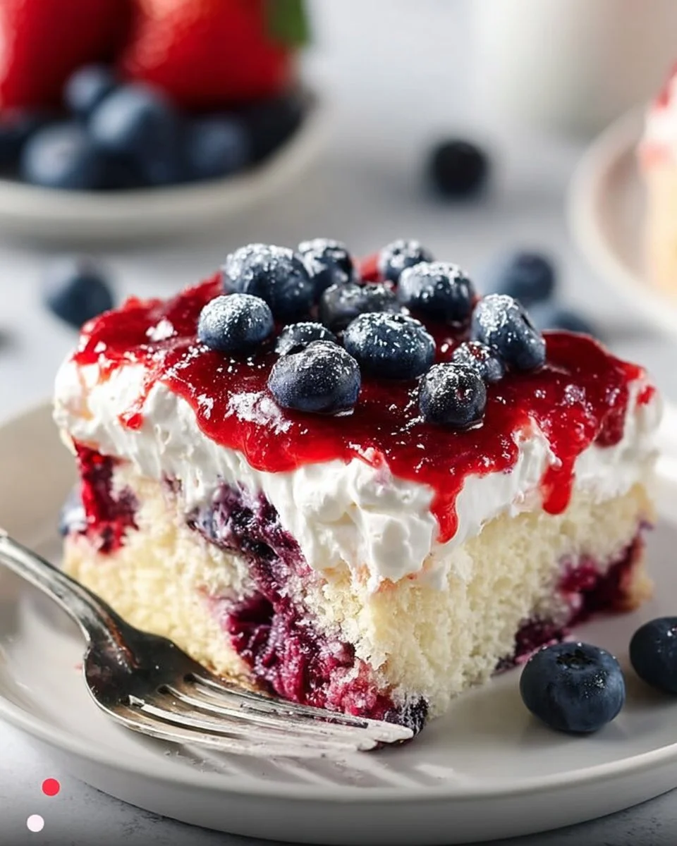 Delicious Summer Berry Sheet Cake topped with fresh berries and creamy frosting