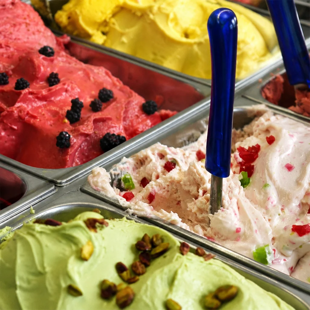 Visual comparison of gelato vs ice cream highlighting differences in texture and flavor.
