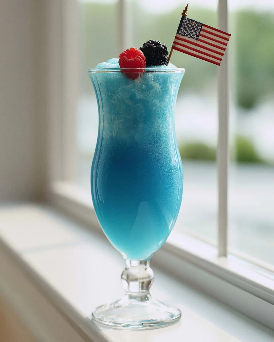 A refreshing Blue Lagoon Slush drink with ice and vibrant blue color.