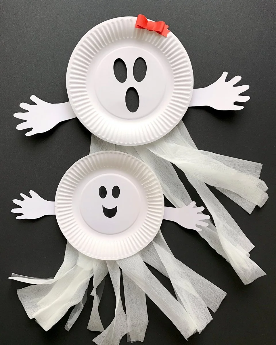Child making a paper plate ghost craft for Halloween