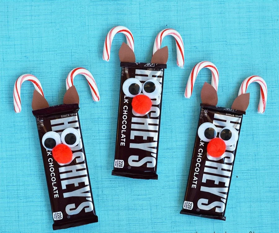 Crafted candy cane reindeer with festive decorations for Christmas