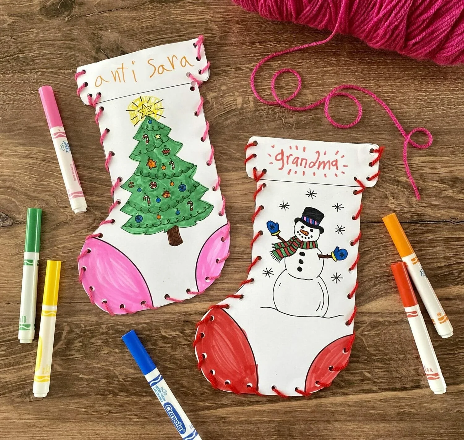 Kids creating fun Christmas stocking crafts for the holiday season.