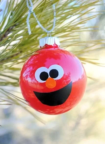 Kids making DIY Christmas ornaments for a festive holiday craft project