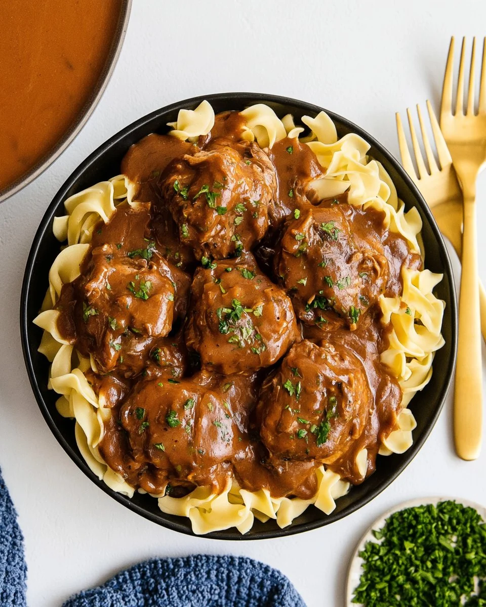 Slow cooker cube steak served with rich gravy and vegetables