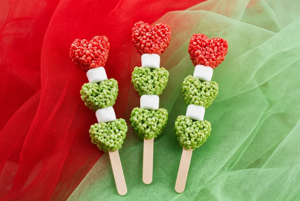 Festive Grinch Hearts Rice Krispie Treats shaped like hearts for holiday snacks.