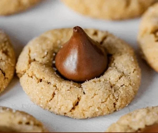 Delicious soft and chewy peanut butter blossoms topped with chocolate kisses.